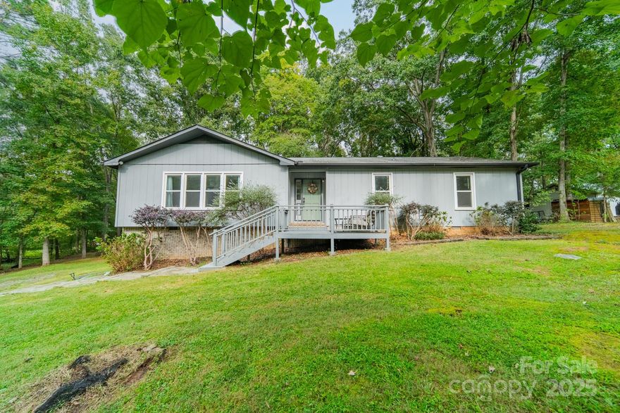 Welcome to this beautifully updated 3 bedroom, 2 bathroom ranch nestled on just over an acre of peaceful and private grounds. Step inside to a bright and open living room that flows effortlessly into a well appointed kitchen featuring stainless steel appliances, abundant cabinetry, and a charming breakfast nook.

Fresh interior paint and new luxury vinyl plank flooring provide a crisp, modern feel throughout. The spacious primary suite offers a relaxing retreat with its own ensuite bath, while two additional bedrooms are connected by a thoughtfully renovated Jack and Jill bathroom. A second family room adds versatility, complete with a cozy wood burning fireplace and built in desk with bookshelves, perfect for work or leisure.

New sliding glass doors open to an expansive back deck overlooking a lush, sprawling backyard a true private oasis for outdoor living and entertaining. Additional highlights include a generous workshop and a wood storage lean to.

All kitchen appliances convey with the home. Perfectly located just minutes from I77, Dave Lyle Boulevard, and a variety of shopping and dining options including Sams Club, Walmart, and Lowes, this residence offers both comfort and convenience.

Schedule your private tour today and discover the lifestyle this property has to offer.