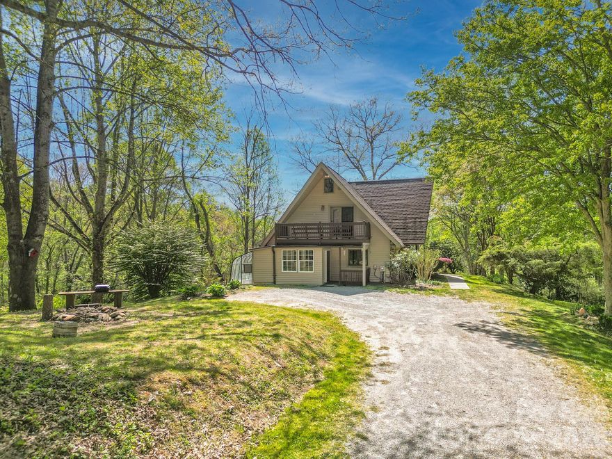 Bring the horses!  Private 10.45 acre homestead in the heart of Mills River with accommodations for animals and ~430’ of frontage on Mills River, yet only 5 mins to grocery, healthcare and restaurants.  A-Frame style home is move-in ready but has not been updated, several windows and doors have lost seal, priced to allow for new owners to make updates.  
Attached greenhouse, multiple outbuildings (all with wired electricity) includes a studio cottage with two car covered parking, deck, mini-split for heat/ac and a nice sized workshop below.  The property also features a large covered equipment and firewood storage building, two stall barn with interior walkway, tack room, hay storage, covered run-in area and separate run-in shed/single stall barn.  Both barns open to fenced pastures with separation between multiple areas and the is a water spigot by the building.  Garden space with mature blueberries, fruit trees in the lower pasture, woodland, river frontage and swimming hole make this property perfect for homesteading or private estate.  
Please no drive by, property is gated.  Professional photos coming soon.