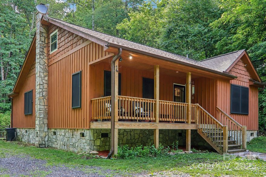 MOTIVATED AND PRICED TO SELL:  This beautiful home just received a significant price improvement, making it a must-see.  Beautiful well-built 2019 cabin-style home on 3.4 private, wooded acres! This meticulously maintained 2-bedroom, 2-bath, 1.5-story is open and airy with 1400 square feet while feeling nestled in the woods. Primary bedroom has an ensuite bathroom and large walk in closet.  Open floor plan.  Kitchen has solid countertops, a large eat at island and stainless steel appliances. Large laundry doubles as a mudroom. Upstairs, an additional 450 sq ft of nearly finished non-heated living area, complete with electrical and sheetrock already in place. Flat fenced-in backyard as well as a private trail loop. Radon mitigation system already installed and in place. Perfect for primary residence, second home or rental property as short term rentals are allowed.  This private location offers a serene escape, yet remains conveniently located just 15 minutes from Cherokee and 30 minutes from Waynesville.
