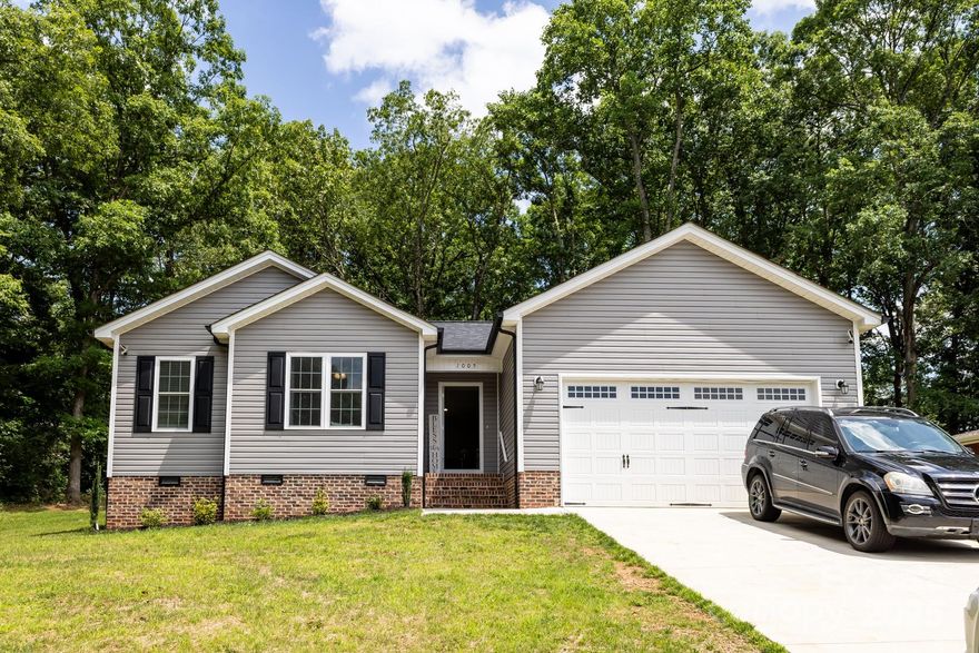 You’ll feel right at home in this charming 3-bedroom, 2-bath gem in a super convenient Conover location! With its cozy vibe and quality touches throughout, this home has so much to love—like real hardwood floors, a vaulted ceiling, and a bright, open layout. The kitchen is perfect for cooking and gathering, featuring granite countertops, an eat-at island, and stylish finishes that continue into both bathrooms. The sellers have thoughtfully improved the outdoor space by expanding the patio, removing 9 trees near the house, and terracing and reseeding the yard for better drainage. The spacious backyard is perfect for relaxing, entertaining, or play. Come see what makes this home so special!