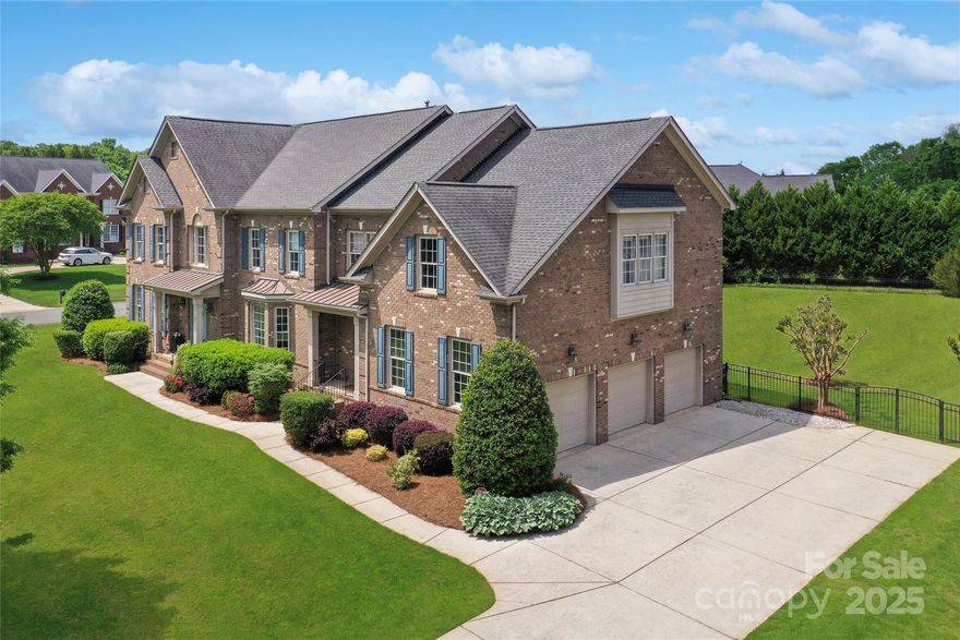 Beautiful expansive full brick home with elegant curved staircase, with a finished 3rd floor that has a full bath, 3 car garage and enormous flat, fenced-in backyard. Home has been professionally designed with updated lighting throughout. Bright open floor plan a two-story great room & foyer, large office on main & second staircase. Massive gourmet kitchen where you can enjoy coffee in the sun-drenched morning room or entertaining, w/GE Monogram cooktop, huge island & breakfast bar w/tons of seating, wall ovens, and walk in pantry. Upstairs find 5 generously sized bedrooms, 2 of those with a Jack&Jill bath, and 1 w/ensuite bath. Primary is extraordinary, with a separate sitting area, exercise room, sizable bath with large walk in closet. 3rd floor features a large bonus room, w/movie screen, and a full bath. Zoned to Marvin schools, walking distance to Marvin Elementary.