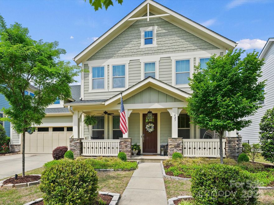 This home will capture your heart with curb appeal and impress you with upgrades.  As you enter past the office, the floorplan opens to reveal an expansive, bright gourmet kitchen with gleaming stainless steel appliances.  The custom island has seating and storage.  In the living room shiplap walls flank the fireplace and add panache.  Gorgeous light fixtures continue through into the breakfast nook that leads to one of the prettiest backyards in the neighborhood.  The Lady Banks roses were just in bloom over the pergola and patio that extend beyond the covered porch.  There is a bedroom and full bath with shower on the main level past the drop zone, with the remainder on the second level.  The primary retreat is impressive with a tray ceiling & spa like bath.  Amazing community amenities include pool, clubhouse, fitness center, playground and trails, some of which lead to the Catawba River. Top rated schools, minutes to 1-77, 20 minutes to Ballantyne and 30 minutes to Uptown.