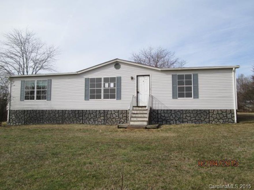 Manufactured double-wide home with 3 bedrooms, 2 baths, kitchen, large living room, and dining room. Home features fireplace, large windows, master bath with doubled sinks and neutral colors throughout. Home sits on 1.02 acre nice large lot with large deck and wooded lot.
