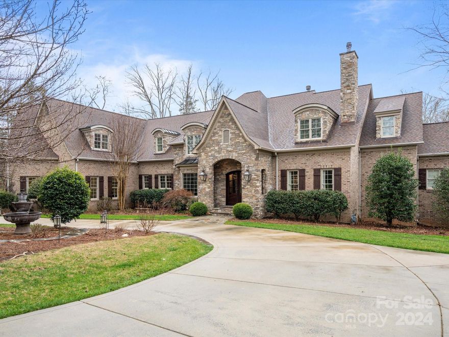 Welcome to this stunning property in Waxhaw—a truly exceptional residence offering a blend of elegance and comfort. Located in the esteemed Weddington school district, this home boasts multiple fireplaces and a convenient primary bedroom on the main floor. Ideal for extended family or guests, the second floor features separate living quarters with a full kitchen.

The finished basement adds versatility with a spa room, wine cellar, bar, and game room—a perfect space for entertainment and relaxation. Outside, enjoy the inviting heated pool and the convenience of an outdoor kitchen with a brick oven grill. The covered patio offers a cozy retreat with a custom built window enclosure, while multiple verandas provide serene spots to enjoy nature. 

Tucked away in a cul-de-sac lot, surrounded by lush greenery, this property offers privacy and tranquility. Don't miss the chance to make this your new home!