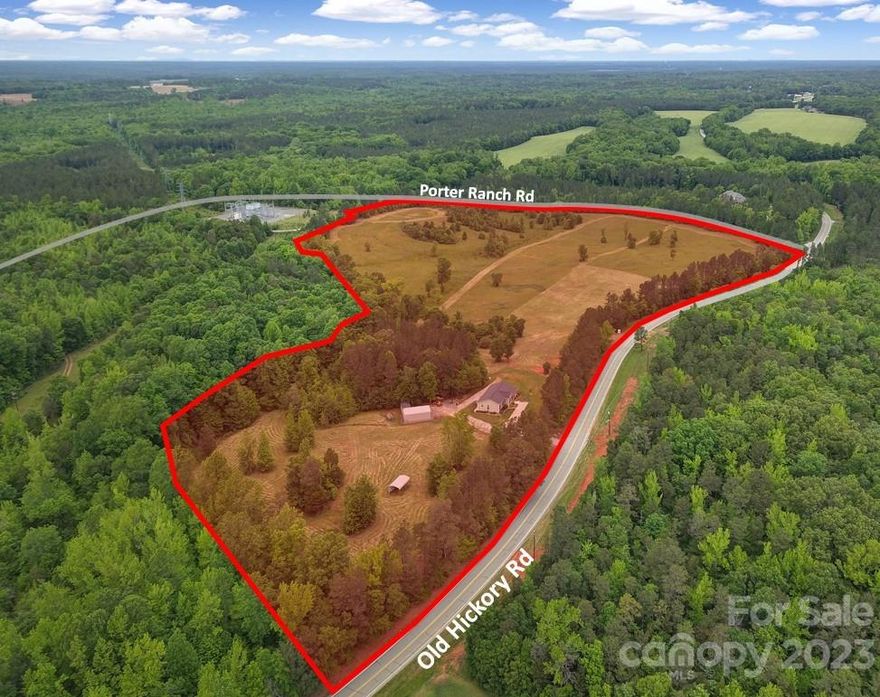 34 acres of gently rolling land and picturesque views in the heart of Lancaster County with a beautiful ranch home built in 2014!  Home includes hardwoods throughout with tile in bathrooms/laundry.  Incredible view from the screened in porch overlooking the property.  Zoned RN (Rural Neighborhood).  Located 2.1 miles west of Hwy 521 near the future Lancaster Sports Complex and Roselyn (Lennar Homes) with over 1,800 homes planned.  Just 10 minutes south is the proposed $413M Gallo Wine Facility.