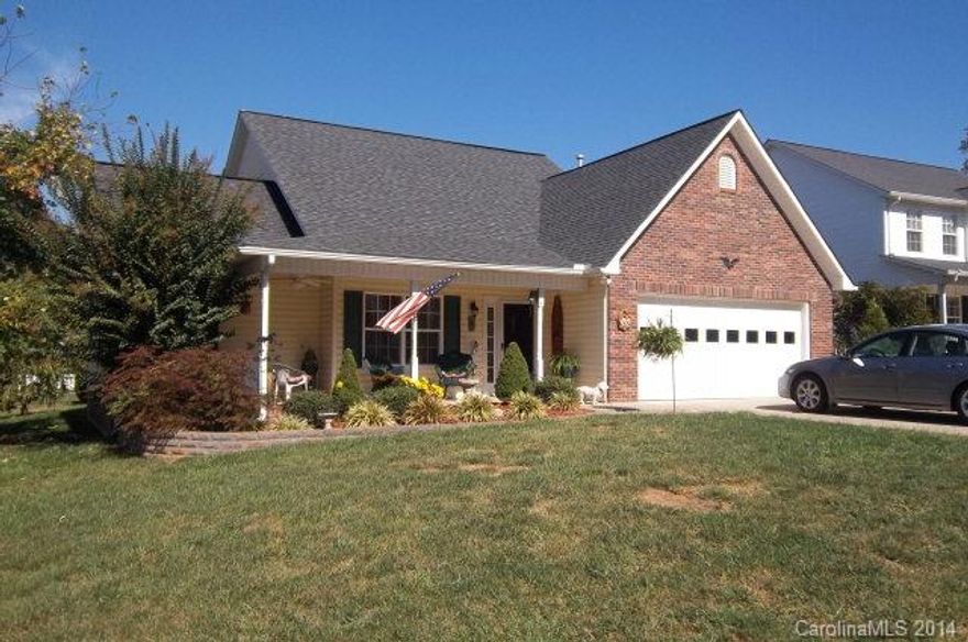 Open floor plan with kitchen/dining/living combo with cathedral ceiling.  Patio with remote controlled "sundowner" awning.  Big storage building and covered front porch.