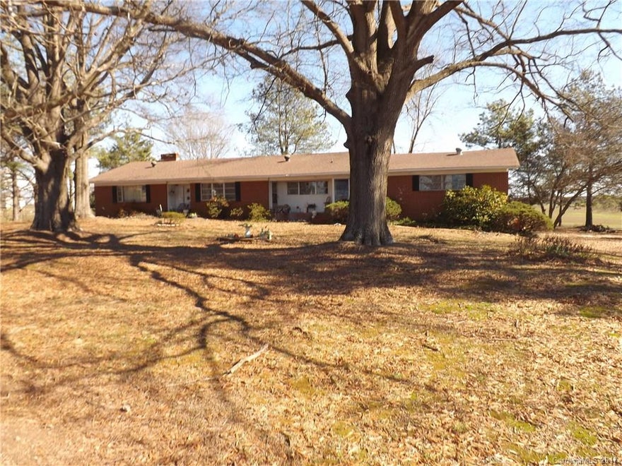 Beautiful land on corner of Hwy 207 and Landsford Road. Great views from the back yard. Large lake on the property. Home needs to be totally updated/remodeled. Roof appears to be in good condition. Land also has a doublewide and a single wide mobile home located on the property.