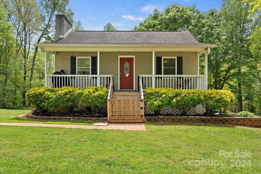 Beautiful country farmhouse, semi-secluded with creek and field views, offers the benefits of country living while still being minutes from downtown Gaffney. The house has three bedrooms and two bathrooms, with the primary bedroom located on the main floor. The other two bedrooms are downstairs, providing privacy and separation from the main living areas. The second bathroom is conveniently located near the other bedrooms. This home also has a spacious front porch with a roof and a moderately sized elevated deck in the backyard. The front porch is perfect for enjoying morning coffee or watching the sunset in the evenings. The elevated deck in the backyard is ideal for relaxing with friends and family. The deck also offers a beautiful view of the backyard, which is landscaped with lush greenery. The property has been divided, leaving an estimated 5+ acres.