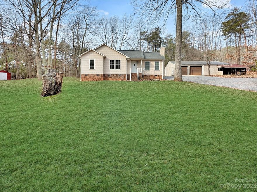 STUNNING move-in ready Ranch home.  This large over an acre lot has tons of privacy, beautiful trees and lot's of room for parking including RV's. Nice vinyl w/ brick underpinning gives this charming home a wonderful look in a very peaceful and quiet neighborhood located just 5 minutes from downtown Clover and only a mile away from schools.  Amazing living room has engineered hardwood flooring & is great for entertaining, has a masonry fireplace, vaulted ceiling and flows into the open kitchen.  The primary bedroom has a gorgeous shiplap wall and plenty big. The primary bathroom has dual sinks.  Across the hall is the other 2 bedrooms which gives additional privacy. Space full bathroom has granite vanity.  Newer deck on the back gives very relaxing vibes w/ views of the tree line. DREAM Large detached 30X40 garage. The workshop has electric and a whole dustless vacuum system for a professional workshop. Additional shed on opposite side of  home for more storage. All furniture can stay!