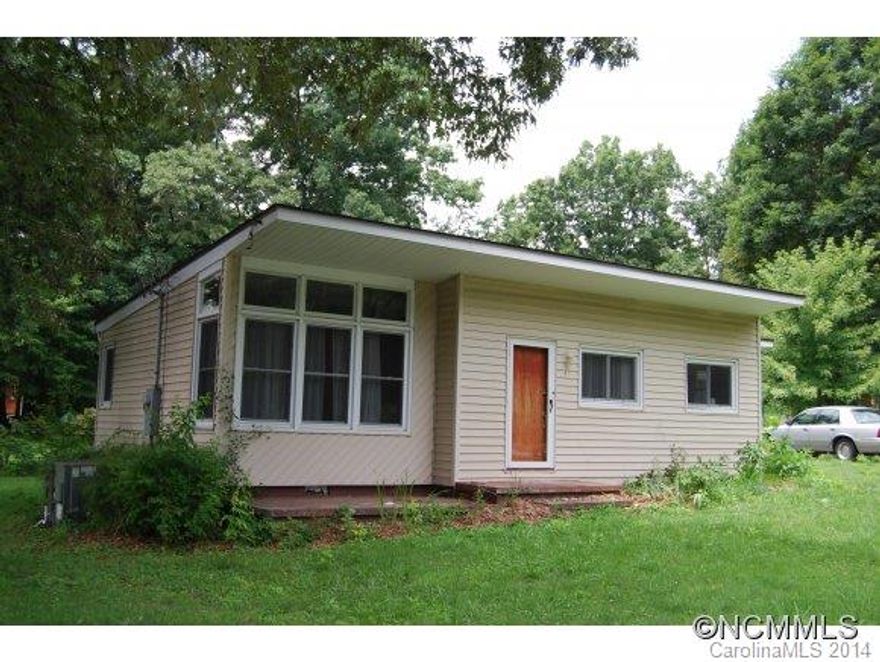 Great starter or investment property offering 2 bedrooms and 1.5 baths on level .40 acre lot.  Home does need some TLC and updating, and has great potential. Convenient to Lake Tomahawk and downtown Black Mountain, yet only 15 minutes from Asheville.