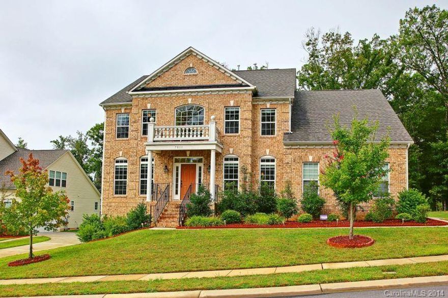 Gorgeous, better than new construction loaded with upgrades.  Hardwood entry leads through open stair case into gourmet kitchen with oversized granite island.  Morning room perfect for enjoying coffee viewing private wooded lot.  Living room features 2 two story ceilings with stunning coffered ceiling.  Master suite on first level with trey ceiling and spacious master bath.  2nd level includes bedrooms and large Bonus/Entertainment room with wetbar.