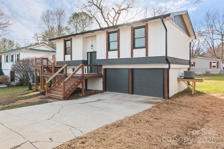 Wonderfully updated and welcoming 3BD/2BA home in a great central location! This move in ready charming retreat  boasts open floor plan with natural light, gorgeous luxury vinyl plank floors throughout, beautiful granite top kitchen with island and seating for 3, soft close cabinets and drawers, stainless steel appliances, spacious living room, dining area, roomy primary bedroom with elegant primary bath with granite top single vanity and tile surround shower, 2 guest bedrooms with full hall bathroom all on the main level.  Large front, side and back decks are an incredible place to entertain and enjoy the fresh mountain air.  Level lot, 2-Car Spacious garage, driveway parking, Unheated lower level multi-purpose room waiting for your personal touch, Minutes to I-40, medical facilities, restaurants, and shopping complete this oasis!