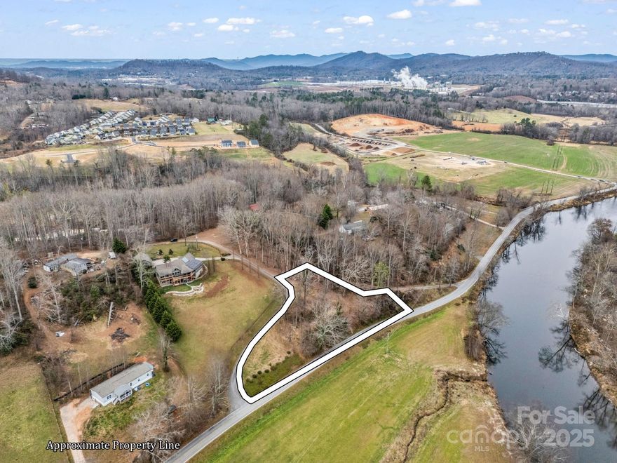 Prime 1.18-acre lot in sought-after Arden, NC—lightly sloped, and showcasing sweeping long-range mountain views. Enjoy rare sightlines of the French Broad River and a neighboring farm for a true one-of-one setting. With no restrictions, this property is wide open for your vision: build your dream home, create a stunning short-term rental, or invest in a high-demand location minutes from everything South Asheville offers. A unique blend of privacy, scenery, and convenience—ready for your next build. Seller has a 3-bedroom perc permit already approved for this lot.