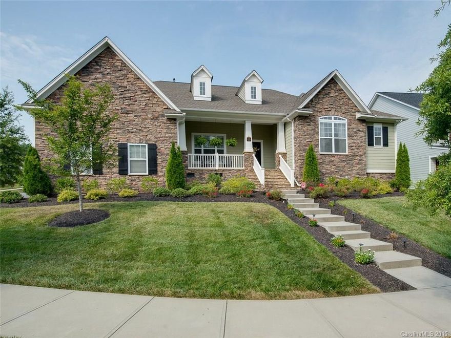 Stunning 1.5 sorry ranch style home in highly sought after Vermillion.  Features include large, open floor plan, with hardwoods throughout main level.  Gourmet kitchen w/ SS appliances, island, granite, double ovens, and marble back splash.  Kitchen/Living area open to large back porch, perfect for entertaining.  Upstairs bonus room is sized for a crowd.  Walk-in attic located off bonus room.  Large corner lot facing common green space.  Walking distance to pool, playground and restaurants.