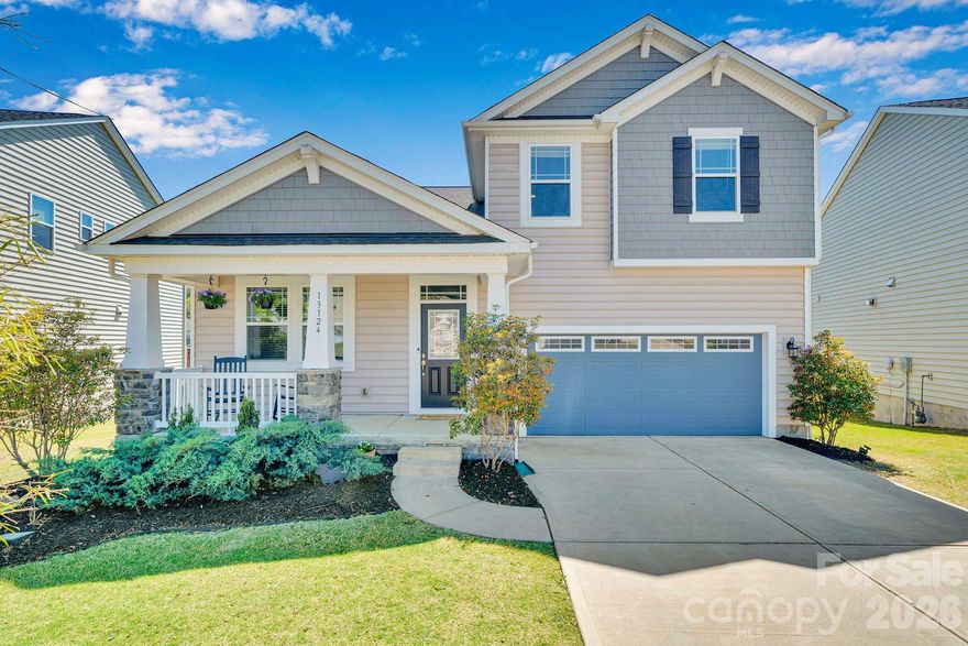 Discover this stunning 4-bed, 2.5-bath home in the beautiful Ridgewater community of Steele Creek. The main floor features an inviting open layout that seamlessly connects the living, dining, and kitchen areas. The living room offers a welcoming focal point with its fireplace, abundant natural light, and open floor plan. The modern kitchen showcases a large island with seating, granite countertops, stainless steel appliances, pendant lighting, and generous cabinet space—ideal for everyday living and entertaining. The primary bedroom and a dedicated main floor office provide comfort and flexibility. Step onto the screened back porch and enjoy serene views of the community pond and its soothing fountain. The upper level includes three additional bedrooms and a spacious loft, offering multiple options for recreation, work, or additional living space. Enjoy access to community amenities, including a pool and playground, adding to the appeal of this exceptional property. Close to restaurants and Rivergate shopping center.