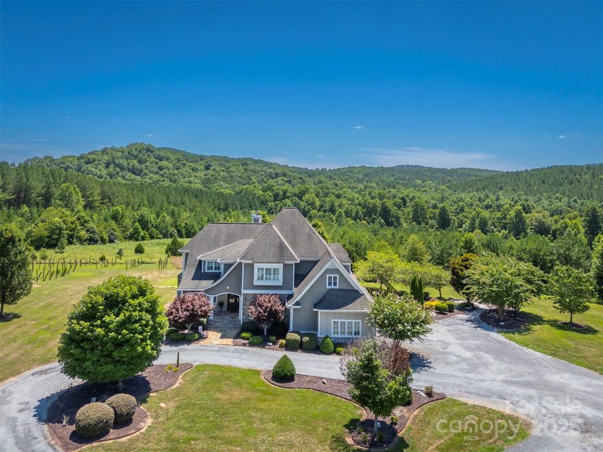 This special property was built for the seller in 2007 and has been lovingly maintained over the years. It is located 5 miles from  Rutherfordton and 10 miles from Lake Lure. On the main level you will find the spacious primary bedroom with a fireplace, his and her closets, and a large en suite bathroom with a garden tub and shower.  On the main level is the kitchen with ample cabinets and storage open to the den area with doors leading out to the covered porch. Two study/office areas, a large laundry room, dining room and breakfast nook are also on the main level. A mud room leads to the garage. Upstairs  are 3 bedrooms with two of the bedrooms sharing a bathroom. In the basement, there is a kitchen  and  den area with a fireplace, bathroom and an extra bedroom.  French doors lead to the beautiful saltwater pool area  along with a custom fireplace for those cool fall nights. Majestic views can be seen from the 27.85 acres.
