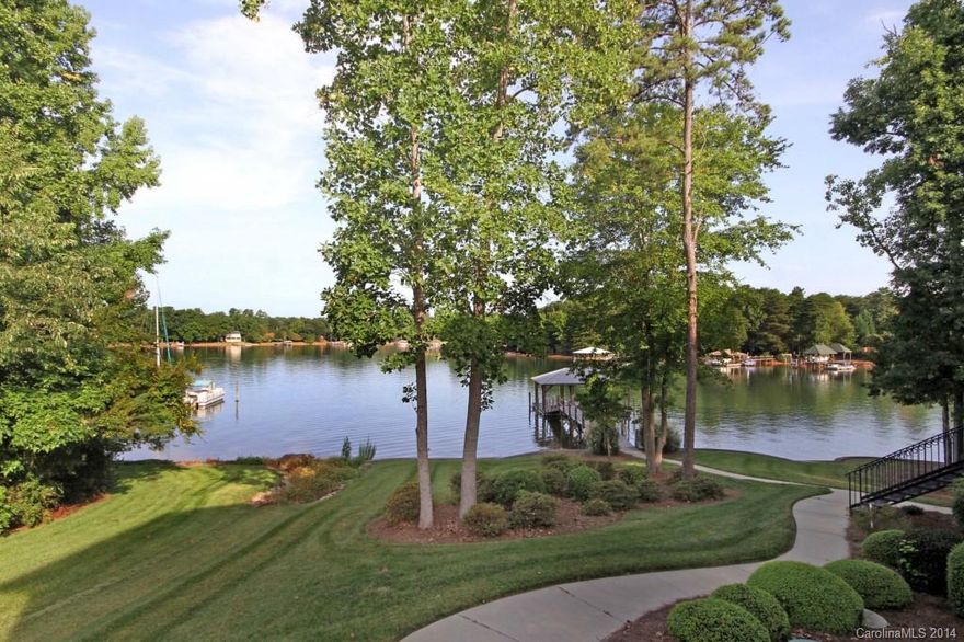 Waterfront w/Basement beauty in The Harbour at The Pointe! Hardwood floors in main rooms. Formal DR & LR/Office. Kitchen w/SS appl, granite, center island/prep sink & eat-in bar. Spacious Master w/Huge closet. Bonus Room & Game Room. Basement GR, Billards, Media rm, exercise, office and w/new carpet. Deck & covered patio. Newer Main level HVAC. Pier & covered Dock w/Slip & Lift.