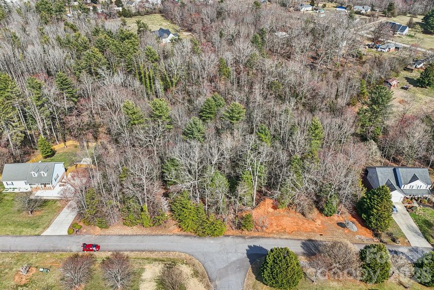 Discover the perfect setting for your future home on this beautiful 0.83-acre wooded lot. Surrounded by mature trees and natural scenery, this property offers a peaceful, private atmosphere while still providing convenient access to nearby roads, schools, and local amenities.

The gently wooded landscape provides a great opportunity to design your ideal homesite while maintaining the natural character of the land. With plenty of space for a custom home, outdoor living area, garden, or workshop, this lot offers flexibility for a variety of residential plans.

Whether you're looking to build now or invest in land for the future, this property combines privacy, space, and natural beauty in a desirable residential setting.
