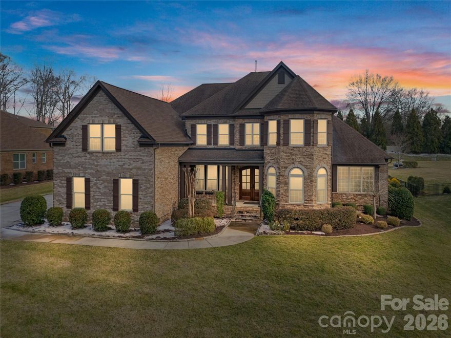 **MULTIPLE OFFERS RECEIVED.**Welcome to 1316 Bromley Drive, a stunning Bromley home perfectly positioned on nearly an acre and zoned to highly-acclaimed Weddington schools. This exceptional residence offers the ideal blend of luxury, comfort and versatility with 5 bedrooms, 4.5 bathrooms and 2 FLEX SPACES designed to adapt to today's lifestyle. The grand 2 story entry and family room draw you into the open floor plan with a lovely stacked stone fireplace and beautiful wood beams on the ceiling. The primary suite on the MAIN level is a true retreat, featuring a spa-inspired oversized shower and custom his-and-hers closets that deliver both style and function. Step outside to your private oasis on 0.93 acre fully fenced, FLAT lot, where the incredible outdoor kitchen and entertainment area set the stage for unforgettable gatherings. The EZ Breeze windows on the screened-in back porch allow for year-round enjoyment as well. Upstairs, all 4 bedrooms have direct access to a bathroom with one bedroom currently styled as a high-end theater room. The custom theater system- screen, speakers, amp and subwoofer- also convey. This home is being sold by its original owners who have lovingly maintained their elegant, spacious home. With it's close proximity to Providence Rd, Waverly shopping center and 485, Bromley is one of Union County's most sought-after communities. Book your showing for opening weekend ASAP.