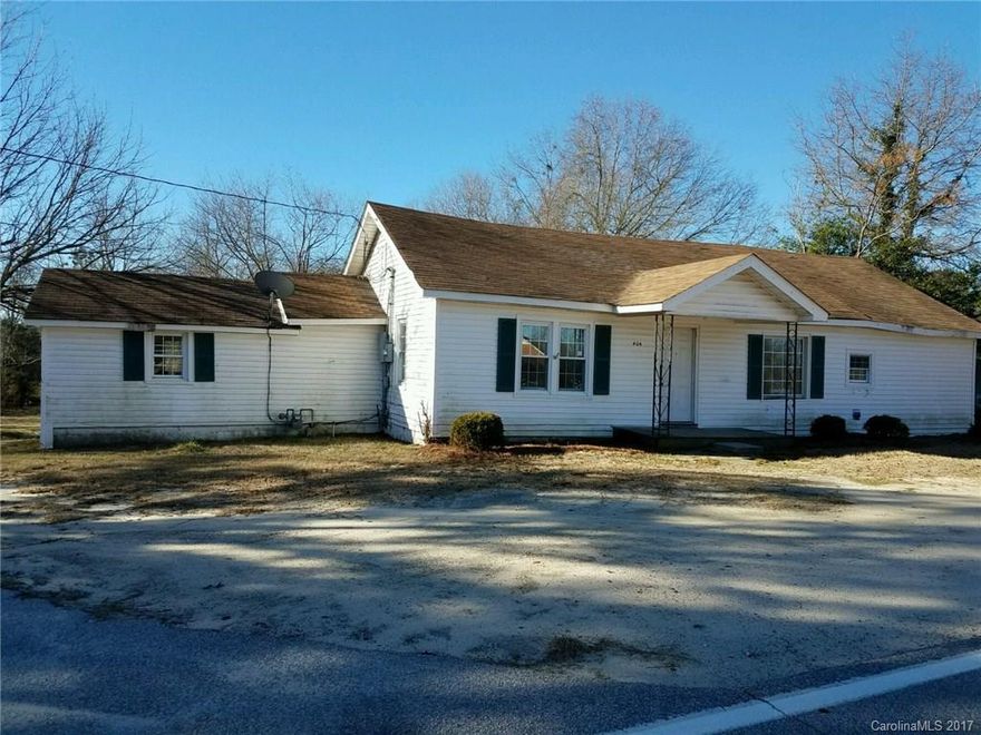 Make this house located on 2.5 acres a home, with your own renovation/update ideas.  It is located in a well established neighborhood, inside the city limits of Pageland, close to area amenities. There is plenty of room to roam in the back yard, that leads to a small pond located on the property.  The spacious house features three bedrooms, one full bathroom, living room, laundry room, and formerly updated kitchen.