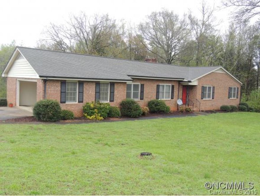 Brick Ranch with three bedrooms and three baths.  Kitchen has many cabinets with lots of storage.  Separate utility with bath.  Large den with fireplace and sliding doors to covered deck.  Partial basement.  Living room that could be used for office or playroom.  5,000 will be given at closing for new windows as some have clouded.