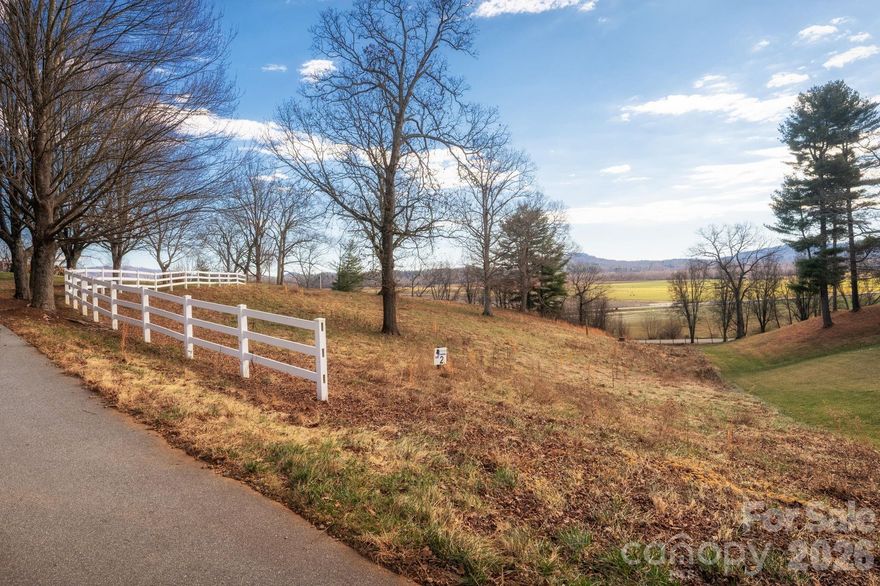 Welcome to The Farm at Mills River — a thoughtfully designed luxury community where natural beauty, modern conveniences, and a true sense of place come together.  This 1.14-acre homesite stands out as the last of its kind: a rare opportunity to build your dream home on a fully built-out, small quiet cul-de-sac neighboring the original 4200sf estate built in 1938, and situated far away from any active farming with aromatic manure stockpiles — ensuring future privacy, serenity, and freedom from neighboring agricultural practices that may affect lots nearby.  479 Nesbitt Drive homesite is blessed with potential mountain and easterly sunrise views and with a gently sloping mountain topography and easy build site makes it ideal for crafting a custom retreat that seamlessly integrates with the surrounding landscape. Enjoy peace of mind and practicality with city water, sewer, natural gas, and high-speed fiber-optic internet already in place — everything you need for modern mountain living.  The Farm at Mills River combines tranquility and community in perfect balance.  Wide, gently winding roads invite leisurely walks or bike rides, while thoughtfully designed community amenities encourage connection and relaxation.  Features include a fishing and floating pond, small beach/picnic area, a pavilion with a stone fireplace, community garden, and a greenhouse — all designed to foster a sense of belonging and outdoor enjoyment.  With reasonable HOA fees of $100 per month and sensible restrictions to protect your investment, this community provides an exceptional environment for upscale living without unnecessary complications.  Ideally located just minutes from Asheville, Hendersonville, and the Asheville Regional Airport, The Farm at Mills River offers unmatched convenience to top-rated healthcare like Advent Health, shops, and restaurants like Sierra Nevada, Mills River Brewery, Burning Blush, Target, Lowes, Walmart and many more — all while maintaining the serenity of a mountain retreat.  Discover everything you’ve been dreaming of in a modern mountain community that blends sophistication, accessibility, and natural beauty — the perfect place to call home.  This exceptional homesite truly offers something you won't find in the rest of the community or surrounding areas.  Welcome home.