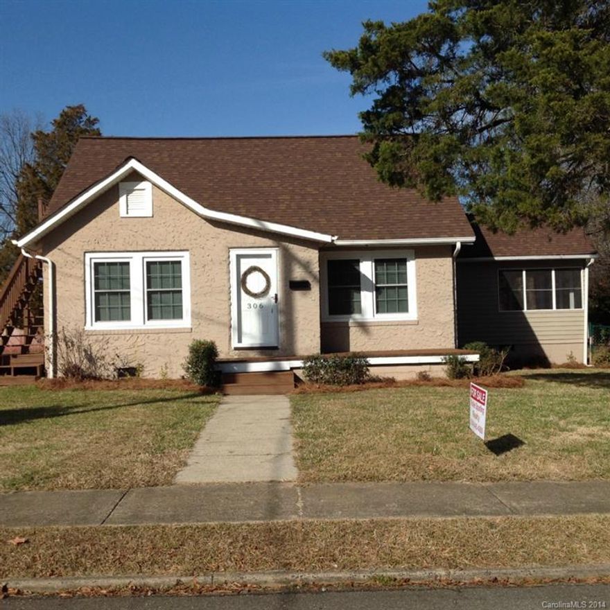 Home is updated and ready to move in, new carpet and paint, kitchen has been updated, laundry room with large closet, screened porch, outbuilding