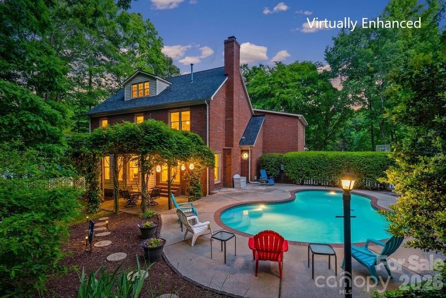 Timeless charm and spacious living define this stately all-brick home built in 1988 and situated on 0.77 acres. Just under 3,000 square feet, it showcases real hardwood floors and a warm, traditional layout. The great room with a fireplace opens to a private backyard oasis with an inground Gunite pool, a pergola-covered patio, and a fire pit—ideal for entertaining. The updated kitchen features granite counters and a large eat-in breakfast area with bay windows. The flexible floor plan includes 3 bedrooms, with options for a 4th and/or 5th bedroom, plus 3.5 baths. Above the garage is a large, finished room with living space, a full bath, and a cafe area (sink and cabinets)—the only missing element is a closet. The primary suite offers generous proportions, a soaking tub, a separate tile shower, dual sinks, and tile flooring. A sizable third-floor bonus room is perfect for a home office or craft space, with walk-in access to expansive attic storage. A side-load garage complements the classic curb appeal. Located in a small, 52-home neighborhood within easy walking distance to shopping, restaurants, and groceries, and just minutes to I-77. Homes like these don't come along often. Schedule your private showing today!!