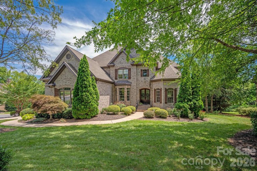 This Providence Downs South estate is set on a beautifully landscaped private homesite and offers over 6,700 square feet of easy living with tons of natural light!

Inside, architectural details create a sophisticated atmosphere starting with the stately office with wood beamed ceiling, which doubles as a bedroom with full bath. The formal living room is a great retreat with built ins, cozy fireplace and an expansive view of nature.  The chef’s kitchen with updated finishes opens seamlessly to a stunning family room w/ fireplace, creating the perfect gathering space for family and guests. A gracious floor plan offers generous bedrooms and a primary suite with a newly remodeled bath.

The fully finished lower level transforms the home into the ultimate entertainment destination with billiards room, fitness area, secondary kitchen/bar, and even a dedicated dog-wash station. Step outside to a large covered patio with outdoor fireplace and bar area - ideal for hosting unforgettable evenings!

Located within one of Waxhaw’s most sought after gated communities, residents enjoy resort-style amenities including clubhouse, pool, tennis courts, and fitness facilities.  Top rated Marvin Ridge Schools!