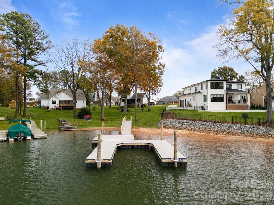 Welcome to 240 Shoreline Loop, one of Lake Norman's most compelling waterfront opportunities. Fully renovated, completely furnished, and already performing as an income-producing short-term rental, this property delivers the rare combination of luxury lake lifestyle and immediate investment returns with no setup required.

Perched near the tip of the coveted Stutts Road peninsula, the home commands expansive open water views that set it apart. A brand new dock invites you straight onto the water, while Stutts Marina is just moments away offering easy access to fueling, a boat ramp, and full lake services. Privacy, panoramic views, and unmatched accessibility make this location as desirable for guests as it is for owners.

This property is a proven Airbnb performer, offered fully furnished and guest ready. The next owner can begin generating short term rental revenue immediately with zero ramp up time. Whether you are an investor expanding your portfolio or a buyer seeking a luxury retreat that pays for itself, 240 Shoreline Loop is built to deliver on both.
Included with the sale is a 2004 Ski Centurion Ski Boat with under 1,000 hours, a 2007 Yamaha 4 stroke 2 person WaveRunner with under 300 hours, and a Pergo Electric Bike with under 50 hours of use. Waterfront properties of this caliber, complete with open water views, a new dock, water toys included, and a thriving rental history, simply do not come along often on Lake Norman. If you have been waiting for the right lake property, your search ends at 240 Shoreline Loop.