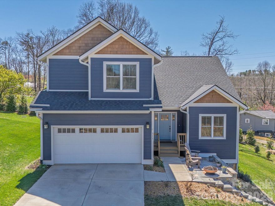 Welcome home to this impeccably maintained, nearly new gem ideally situated minutes from Biltmore Park and the best of Asheville living. From the moment you step inside, you'll notice the difference from gleaming hardwood floors, soaring 9-foot ceilings, and an open floor plan that invites natural light at every turn.
The kitchen features granite countertops, a breakfast bar, and a huge pantry — perfect for entertaining or everyday comfort. The primary suite on the main level is a true retreat, boasting a large ensuite bathroom and an expansive walk-in closet that will exceed your expectations. Upstairs, a large bonus room offers endless flexibility as a home office, media room, playroom, or guest space, whatever your lifestyle demands. Two additional bedrooms and a full bath complete the upper level. Enjoy the outdoors from your covered back deck or soak up the sunshine on the flagstone patio out front. A two car garage complements the home, allowing ample parking for everyone. This home lives large without sacrificing the ease of low-maintenance living. Every detail has been thoughtfully cared for, making this truly move-in ready. All of this, just moments from the dining, shopping, and greenways of Biltmore Park, with the arts, culture, and outdoor adventure of Asheville right at your fingertips. Schedule your showing today!