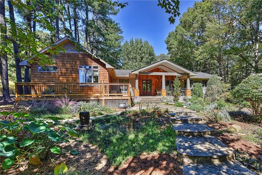 Looking for Country Living with City Convenience? Look no further! This charming, spacious, rustic, craftsman home has it. Almost an acre lot with a wired workshop and detached garage, decks and/or porches on every side of the house, nothing but views of trees out every window. Meticulous attention to detail meets abundant character and charm. 2 Bedrooms with Closets but office could be a 3rd Bedroom. Large Master Suite w/updated  bath. Stainless appliances and granite counters in kitchen.
