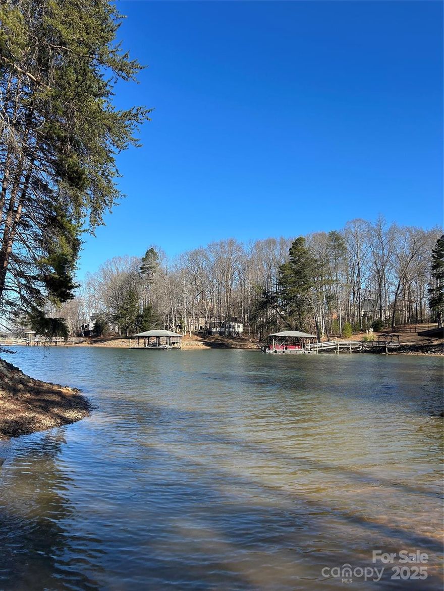 Build your Dream Home on Lake Norman on this incredible .73-acre Lakefront Lot and enjoy life along the stunning shores of Lake Norman! This beautiful property is located in a quiet cul-de-sac in the fabulous Lake Norman community of Norman Pointe. This Lot offers breathtaking, year-round views of the Lake and the chance to create your very own private paradise. Nestled within the established and prestigious community, Norman Pointe and its high-valued homes, this Lot is primed for your dream home! With city water and city sewer access, you're free from the constraints of septic system bedroom limits, allowing you to build the perfect Home tailored to your needs. Norman Pointe offers boat storage for its residents and Lake Norman boat launches are within minutes from the great Lot! Don't miss this great opportunity to build your Dream Home on Lake Norman! Tour it today!