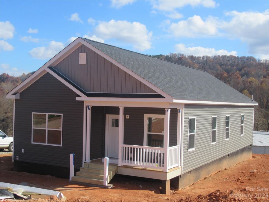 Seller is now offering up to $6800 towards a 2/1 rate buydown with an acceptable offer. Construction is almost finished! This beautiful off-frame modular ranch-style home is conveniently located in East Marion for easy access to downtown, I-40, Lake James, and other area amenities.  Interior features include open great room, 9' ceilings with a smooth finish, stainless steel appliance package, walk-in tile shower in master bath, covered front porch and deck.