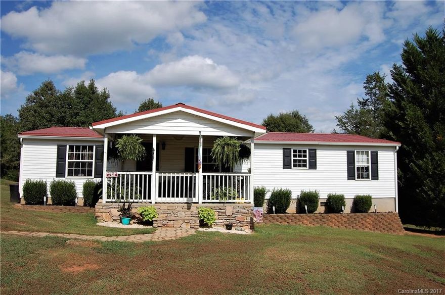 Almost two acres of peace and privacy out in the middle of the York/Clover area. Curb appeal without the curb. Grab a glass of sweet tea and relax on the front porch after some yard work. Enjoy the soothing sounds of rain on a tin roof while you snuggle near the fire. Open living and dining areas and spacious bedrooms provide plenty of living space and the yard provides endless opportunities for outdoor living. This home is perfect for your family.