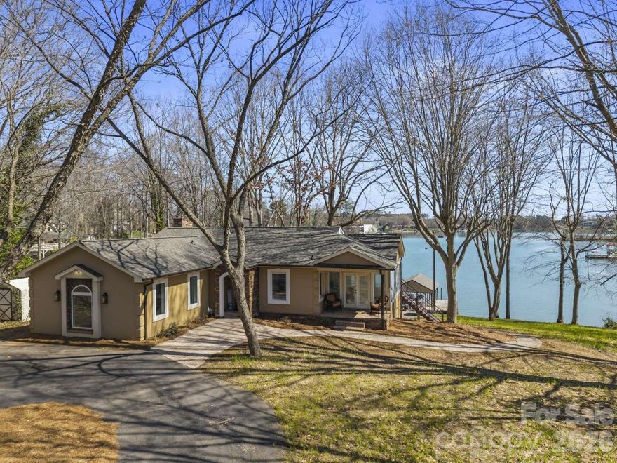 Beautiful waterfront home on Lake Norman in the desirable Sherrills Ford, North Carolina area! Situated on approximately 0.61 acres, this property offers stunning water views, privacy, and direct lake access. The home features 3 bedrooms (2 BR Septic permit) and 3 full bathrooms with a warm, inviting layout designed for comfortable living and entertaining. A spacious family room flows into the kitchen and gathering areas, while large windows fill the home with natural light and capture peaceful lake views. Step outside to enjoy the large deck and covered porch, perfect for relaxing or hosting friends and family. The property also includes a covered deep water boat slip with jet ski parking, making it easy to enjoy boating, fishing, and all that Lake Norman has to offer. Ideal as a full-time residence, weekend retreat, or investment opportunity with convenient access to shopping, dining, and local amenities.