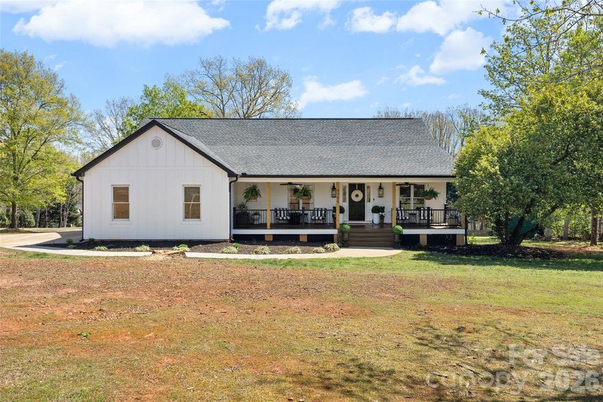Welcome home to this beautifully renovated 5-bedroom, 3-bathroom single-family residence in the highly sought-after Crosswinds neighborhood near Lake Wylie. Situated on a spacious 1-acre corner lot with no HOA, this 3,230 heated square foot home offers the perfect blend of modern luxury and comfortable living. Step inside to discover stunning 6” white oak hardwoods throughout the main level, complemented by Taj Mahal leathered quartzite countertops and custom KLJ soft-close cabinetry in the fully redesigned kitchen. Café white appliances and elegant brass hardware add warmth and sophistication, creating a space that’s both functional and inviting—the true heart of the home.  The thoughtfully designed layout offers room for everyone, including a second living quarters in the basement—ideal for extended family, guests, or a private retreat. The primary suite features plush new carpet and custom closet systems, with additional custom closets in the main floor bedrooms for effortless organization. The basement also includes LVP flooring, a spacious living and kitchen area, and two additional bedrooms with new carpet, a recently remodeled full bath, and a flex/office space.  Outdoor living shines with brand-new Trex decking on both the front porch and rear covered porch and deck—perfect for morning coffee, evening gatherings, or just enjoying the expansive yard. Recent upgrades provide peace of mind, including a new hot water heater, new water softener, new black soffits and gutters, and more. Car enthusiasts and hobbyists will love the two-car main-level garage plus a deep one-car garage/workshop on the basement level, offering exceptional storage and workspace flexibility.  This move-in-ready home combines timeless finishes, modern updates, and generous indoor-outdoor living—all in a quiet, established neighborhood just minutes from Lake Wylie.  A rare opportunity for buyers seeking space, style, and freedom—without HOA restrictions in the award-winning Clover School District. 1-Year Old Republic Home Warranty offered with an acceptable offer. Call today for your private showing!
