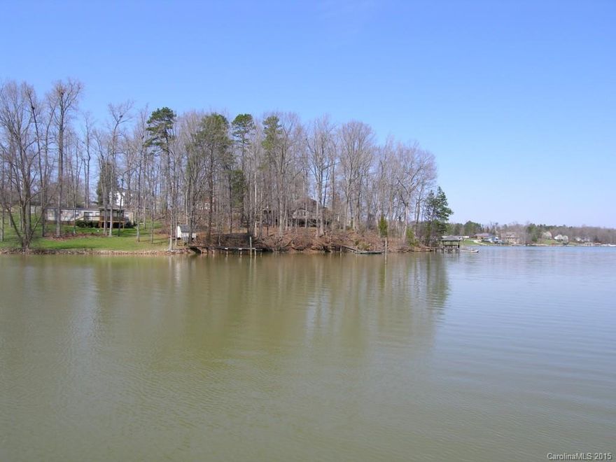ONE OF LAKE NORMAN'S BEST BUYS! Beautiful 1.04 acre waterfront lot with private dock and covered sitting area. Brazilian hardwood decking. Cove has been dredged. Gently sloping lot is perfect for a basement home. Gated Pebble Bay community convenient to Charlotte and Mooresville and the "Village at Sherrills Ford" coming soon. Septic permit on file for 4 bedroom home. Community well. Priced below tax value! Bring your own builder. No time restrictions on building. Motivated Seller!