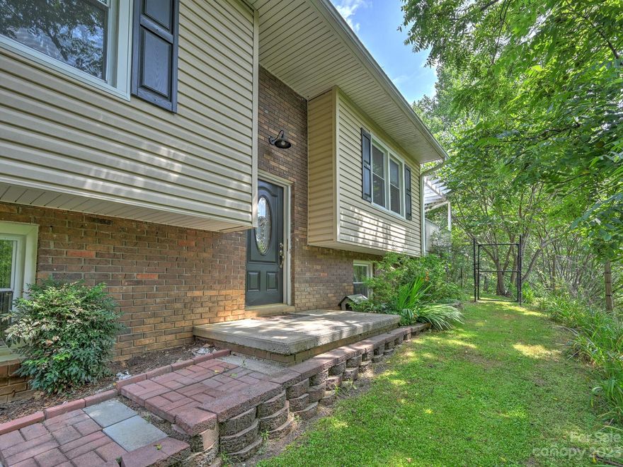 Mini farm w/quiet setting located in Marshall! This property consist of three separate lots totaling over 6 acres. The home has 2 bedrooms & 1 full bath on the main level & a den, 1 bedroom, 1 full bath & laundry/storage area on the lower level. Spacious sunroom & large deck make for a perfect morning or evening to relax. Backyard is fully fenced & offers multiple types of fruit trees! There is a carport, workshop w/ electricity & (1) 400 gal. water tank used for water storage. The lower lot across the road is ideal for gardening, entertaining or small farm animals. It also offers, large potting shed, (2) High Tunnels that are both 50'x20', (2) 550 gallon water tanks, gazebo & small stream. Property was once a mini permaculture farm which was a no till & no spray meaning no herbicides or pesticides were used. Very convenient drive to downtown Marshall (8 min), Hot Springs (16 min), Weaverville (23 min) & Asheville (30 min). Great opportunity to continue or start your own mini farm!