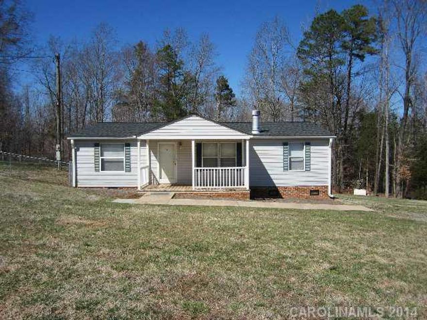 Neat 3 bedroom, 2 bath with detached carport, storage bldg., fenced yard, 3.02 acres in West Davidson area. Living room with wood burning fireplace, open to dining & kitchen with snack bar, range, refrigerator, dishwasher, microwave. Split bedroom plan- master bedroom & bath w/ garden tub & separate shower. Ready to move in.
