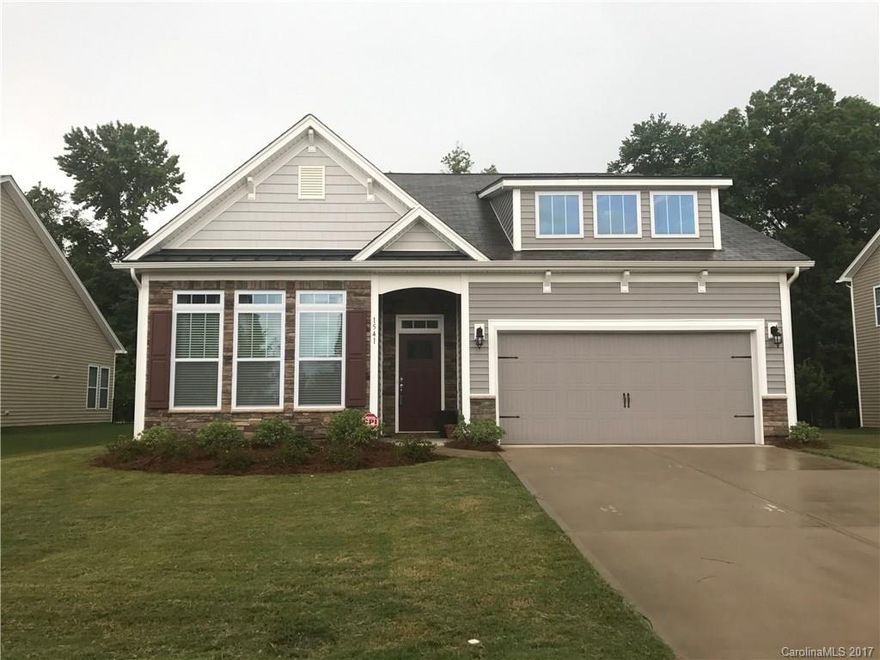 This stunning move in ready home has a wide open floor plan with beautiful hardwood floors! HUGE kitchen island topped with beautiful granite is perfect for barstools and entertaining. Stainless appliances. Built in drop zone in the laundry room right off the garage! High ceilings, decorative moulding, and transom windows throughout!