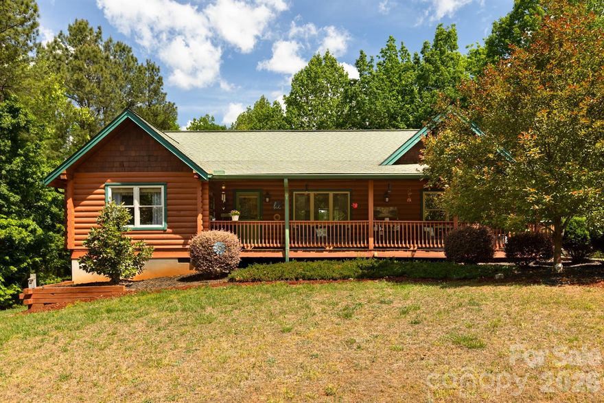 Located on top of a mountain in a gated community, this could be your dream log cabin retreat, investment property or primary residence! This one-level cabin, on a 1-acre mostly level lot, is part of Yellowtop Mountain Estates. Once you’re behind the gate you make your way up to the cabin with some of the most gorgeous mountain views. When you arrive at the home you step inside an open-concept layout that seamlessly integrates the living, dining, and kitchen areas into one beautiful space. This floorplan creates a smooth flow for daily living and entertaining. There is no shortage of rustic charm with the beautiful hardwood flooring and log cabin finishes. In the kitchen you’ll find a huge bar and granite countertops that provide plenty of space for hosting or prepping. For added convenience enjoy a gas stove to cook with. The split floorplan gives you and your guests good privacy with the primary bedroom situated on one side of the home with the two additional bedrooms and extra bath on the other side of the common areas. In the primary bedroom you have a vaulted dormer window for added light. It features an ensuite bathroom and a nice size closet. There is also a separate laundry room off of the kitchen. Behind the home you’ll find the grassy yard, a large powered outbuilding with a freezer and garage door opening. There is also a ready-to-go hot tub platform with power. 

Step outside to enjoy nature from either the long covered front porch or relax on the back deck, perfect for grilling or your morning coffee. Whether watching wildlife or stargazing, enjoy mountain life in this beautiful setting loaded with outdoor fun! Nearby are several camping areas, game lands, lookouts and trails. Jellystone Park is less than 20 minutes away, Lake James and Lake Lure are both around 45 minutes away and for shopping Forest City is a short 20 minute drive. Come make this cabin yours today!