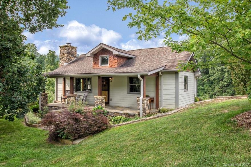 Solid, sturdy craftsman-quality home on 5 beautiful acres close to town! Desirable Woodfin Area, 13 minute from downtown Asheville, and just minutes to the River Arts District.  Make this pastoral plot your own personal mini-farm, landscape showcase, or home based/studio business out of the barn, potting shed or cottage.  Pasture, pond, creek and ample outdoor entertaining space add value to the incredible split 2 bedroom, 2 bath farmhouse that is surrounded by stone. Imagine the possibilities…