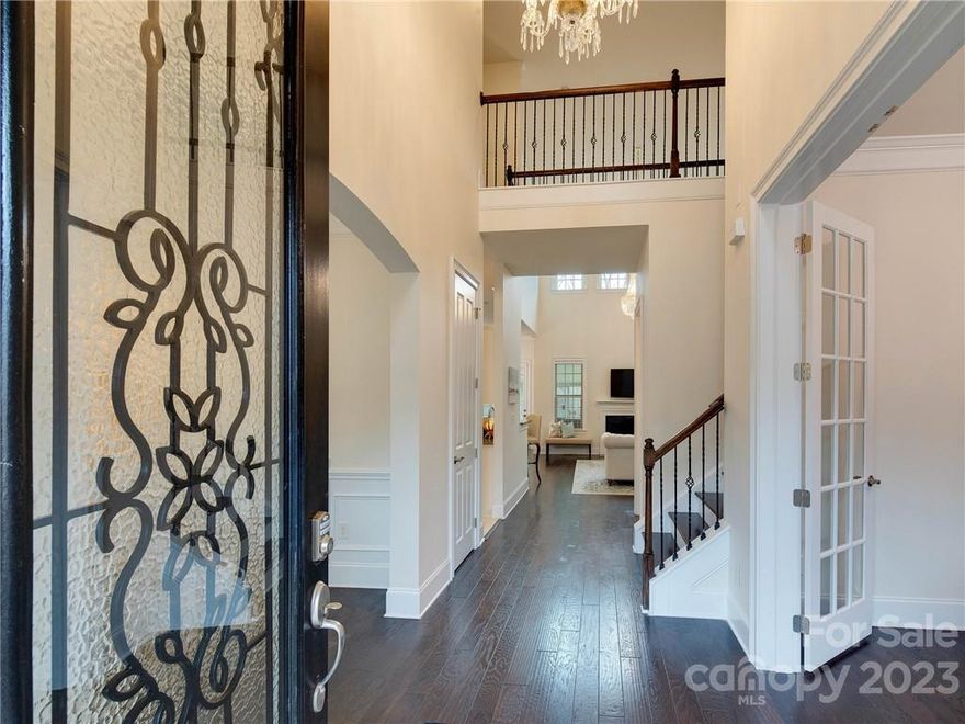 Updated luxurious estate style home minutes away from Lake Wylie public access with a large fenced and privacy landscaped lot ready to become your dream home! Freshly painted interiors and updated lighting!  Two story entry hall flooded with natural light. Formal dining room and dedicated office with french doors open into the great room for the perfect entertainer's floor plan. Crisp, white kitchen provides the perfect statement and includes wall oven with microwave, a gas range, and an island filled with storage. Enormous three seasons room off breakfast area is the ideal space to lounge and watch the deer prance through the wooded area behind the fence in the morning. Primary bedroom is expansive with lovely trey ceiling, and the primary bath features elegant cabinetry and double sinks. Upstairs, generous secondary bedrooms and closet spaces as well as loft area provide the perfect environment for comfort and ease. 5 minutes from public access to Lake Wylie!