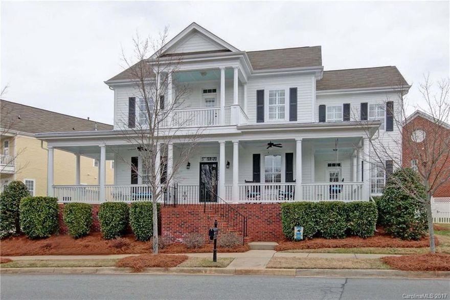 Gorgeous Charleston style home w/double wrap around front porch & over sized lot! Open Saussy Burbank floor plan w/$24k in custom upgrades. Beautiful hardwoods downstairs. All m/bdrm &  front windows have plantation shutters. Kitchen has SS appliances, tiled back splash & quartz counters. Enjoy a glass of wine & gorgeous views from your upstairs balcony.Multi-function 5th bedrm is media rm, office, or playrm. Patio & pergola are perfect for outdoor entertaining. Located near pool and  park.