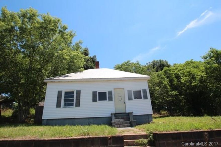 Handy Man Special. Mill House with good potential. Hardwoods in most rooms. Metal Roof except for back addition. Two porches have been enclosed and included in SF. Propane tank on side of house (not sure of what it is used for). Selling As Is. Cash Only.