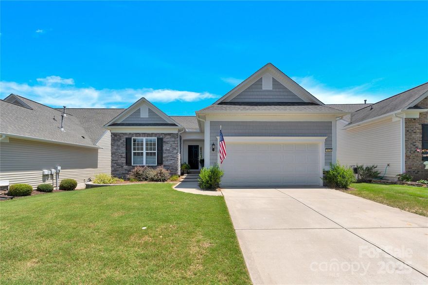 Immaculate Copper Ridge basement home is move-in ready! Main floor has a separate office; Guest bedroom with/ adjacent Full Bath. Kitchen - granite countertops, tile backsplash, SS appliances, and under-cabinet lighting. The eat-in breakfast bar connects to the Dining area and flows to the Sun Room and deck, complete w/gas grill connection. The primary bedroom features a tray ceiling and an en-suite bath that includes a standalone shower, double vanities, and a spacious walk-in closet. Downstairs, the fully finished walk-out basement offers versatility. A large Flex room provides endless possibilities, such as a media room, exercise space, or hobby area. The third bedroom suite with a sitting area is perfect for family or guests. Unfinished storage area includes a shop with a workbench/pegboard, and it's heated/cooled. The extended covered paver patio offers a private space for outdoor living. Enjoy the resort-style amenities of Sun City Carolina Lakes.