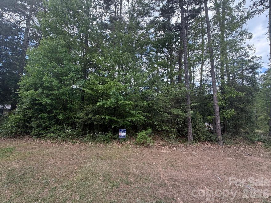 Welcome to Pinehaven, a community at Badin Lake. This vacant lot offers a perfect opportunity to build your dream lake getaway or full time residence. With a voluntary HOA, residents can join an enjoy access to a boat ramp and a designated lake area for swimming and relaxation. Whether you envision a stick-built, modular, or manufactured home, Pinehaven provides the ideal setting for your lake retreat. Start planning your perfect escape today!