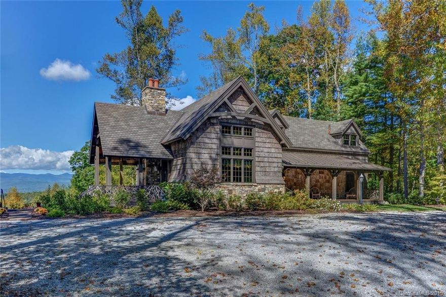 Situated on 7 plus acres offering magnificent uninterrupted long range mountain views is the ultimate in mountain living. Impeccable attention to detail & high-end finishes throughout.From the dramatic great room w/ stone fireplace & reclaimed oak ceilings to the rhododendron railings & Birch Bark painted walls, this is truly a mountain masterpiece. Outdoor living abounds w/ patios, covered deck w/ stone fireplace, screened porch, front porch & 2 ponds w/ dock.