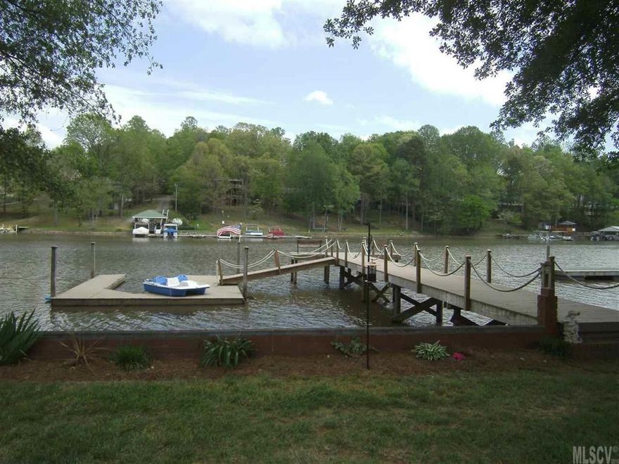 Beautiful waterfront home offers everything needed for Lake living. Updated home offers wood floors on main area, awesome kitchen with granite counter tops, lots of cabinets for storage and nice size eat in dining room, Main floor has bedroom that could be second master bedroom or office with bath. LR offers a beautiful gas log fireplace and spiral staircase. Master on 2nd floor is a wonderful size with bath, beautiful lake views and walk out deck for sitting and watching all the wildlife. 2nd floor has 2 more bedrooms and a full bath. Lake views from almost every room. The update pier with composite material and floating dock makes living on the lake  a dream come true. Yard has beautiful landscaping and nice level .91 lot. Move-in ready just bring the jet ski and start having fun. Priced to sell at 59,000 below tax value This home has been well taken care of a MUST SEE!!